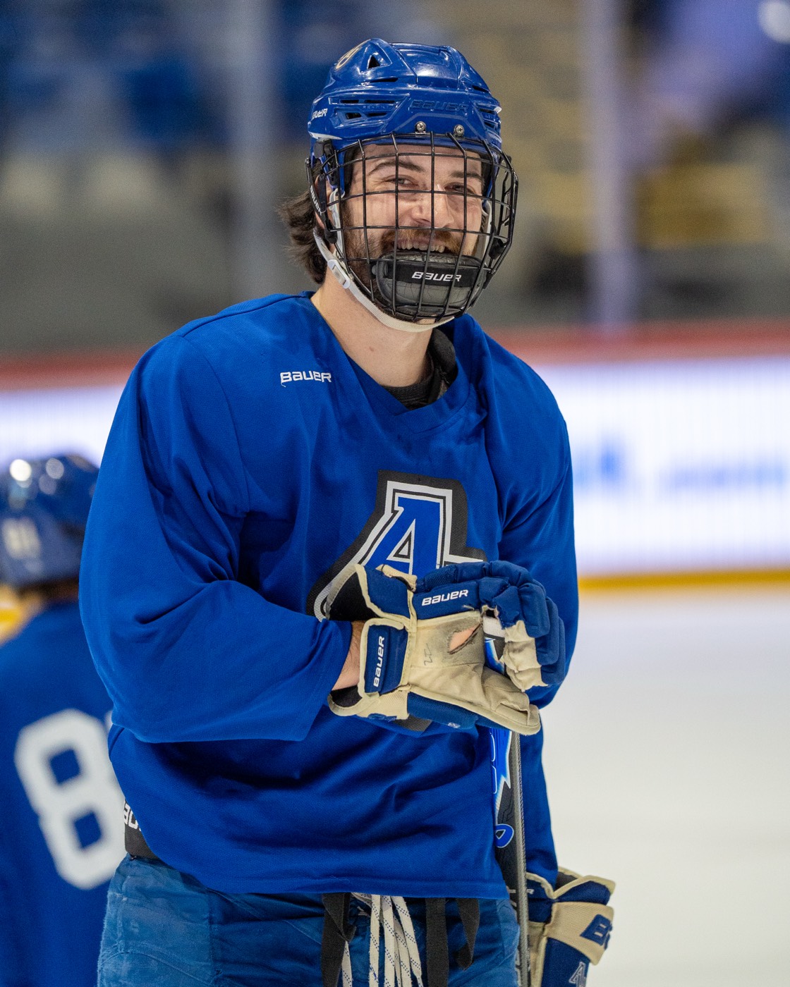 Aurora hockey player portrait on the bench