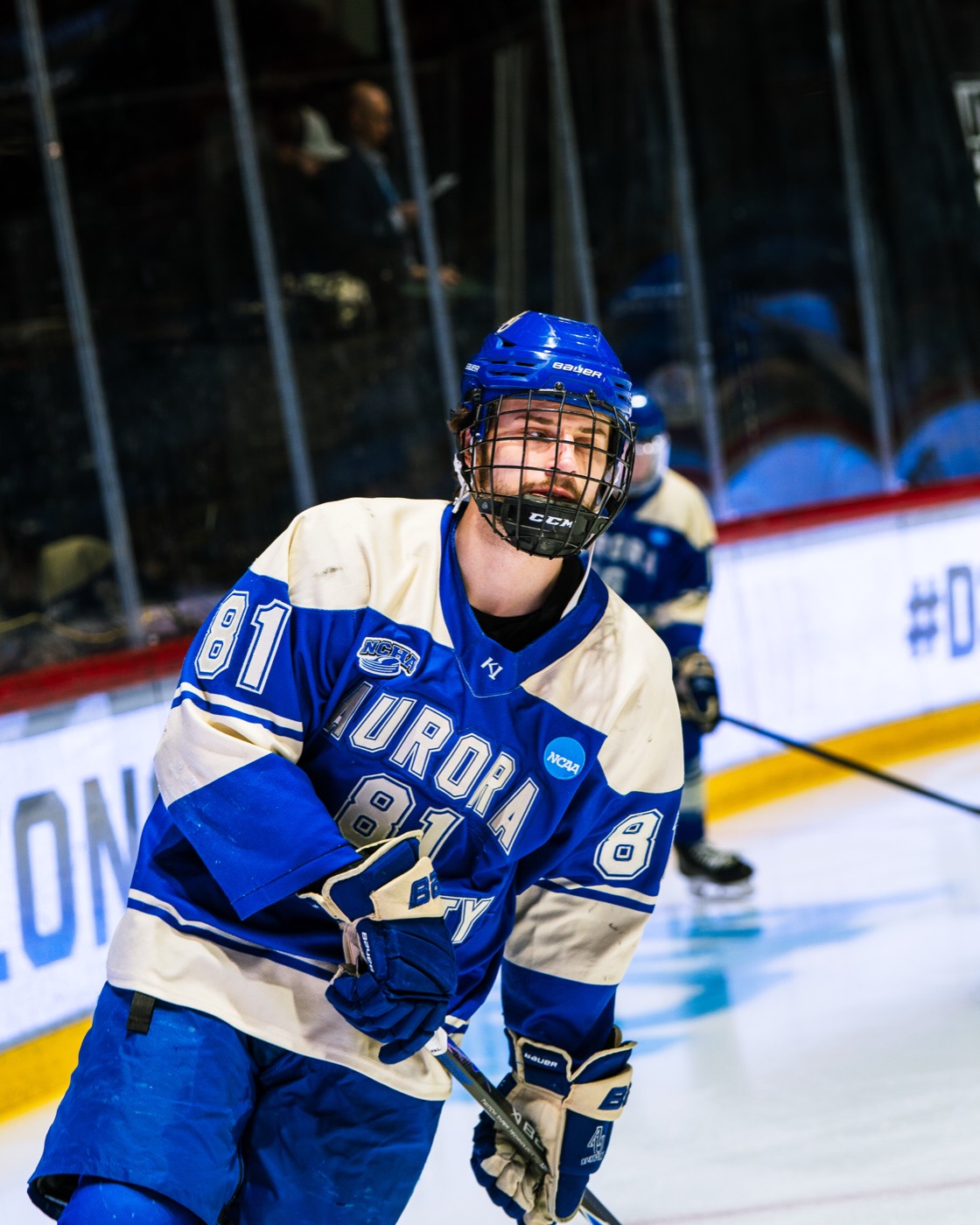 Aurora hockey player skating during warmups