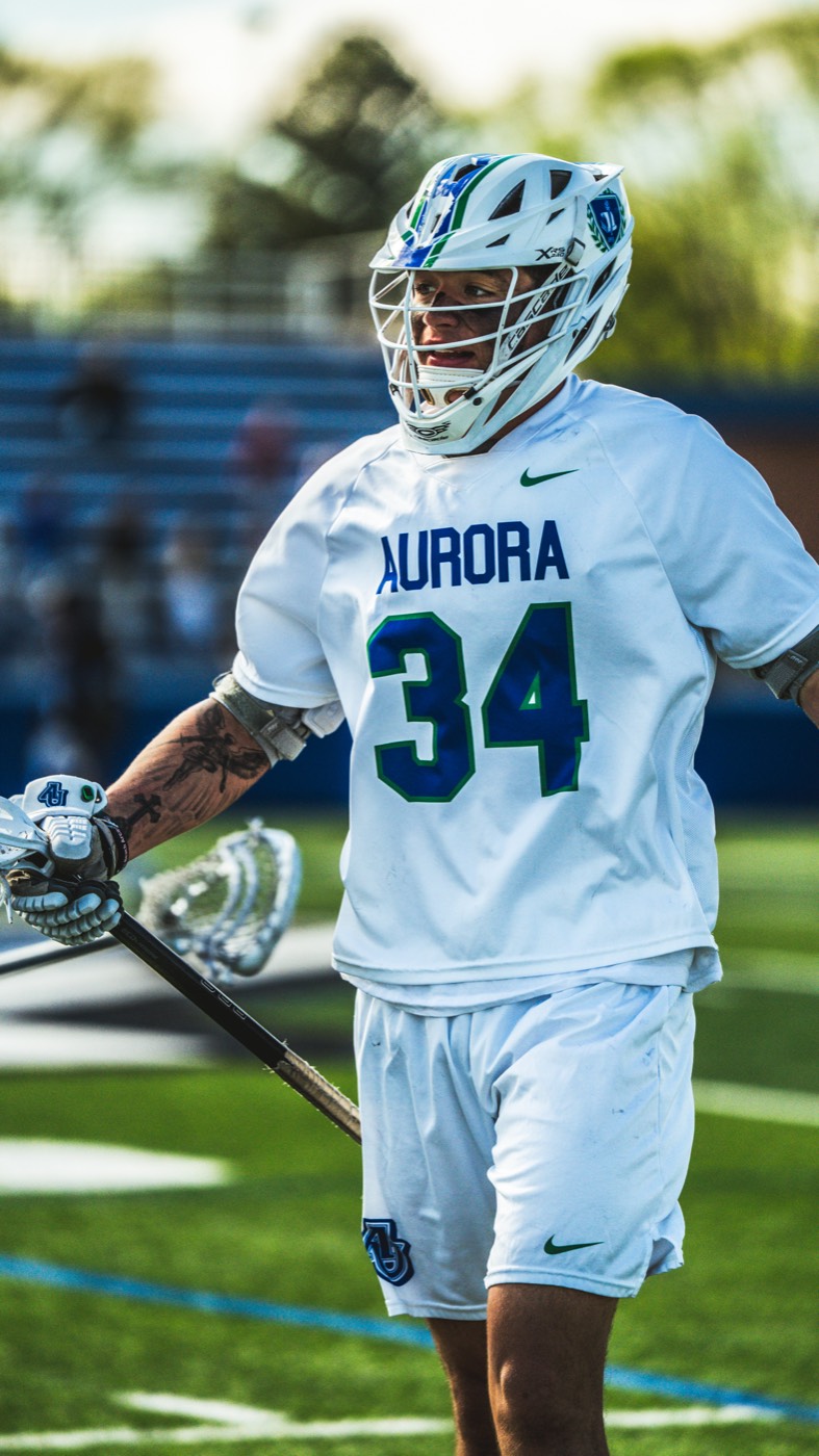 Aurora lacrosse player number 34 walking the field