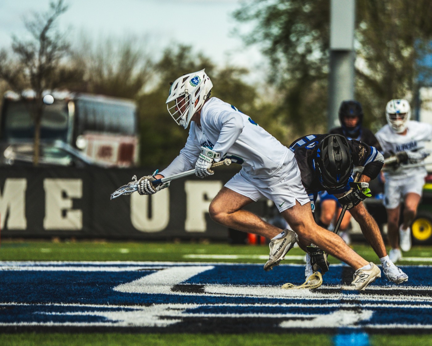 Lacrosse attacker diving toward the crease