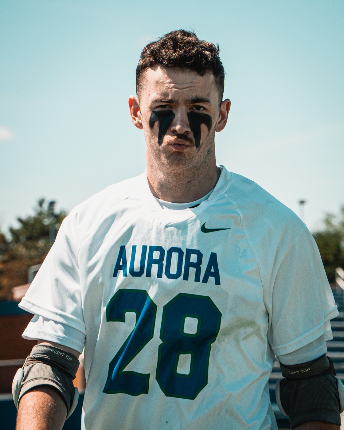 Lacrosse player with eye black looking downfield